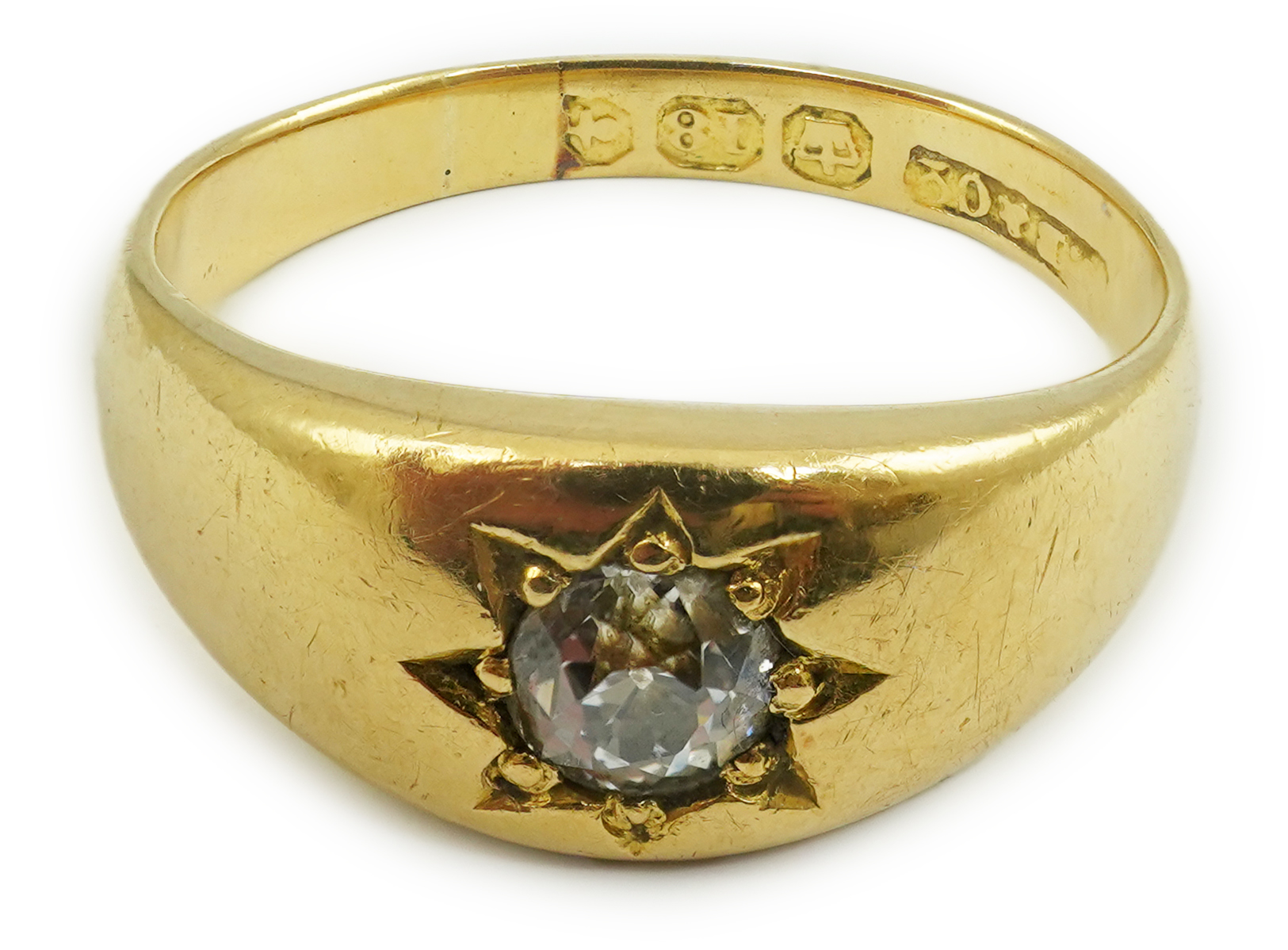 An early 20th century 18ct gold and gypsy set solitaire diamond ring